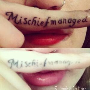 Healed finger tattoo.