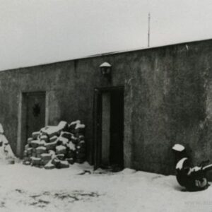 Photo taken after war. Chimney and door rebuilt.